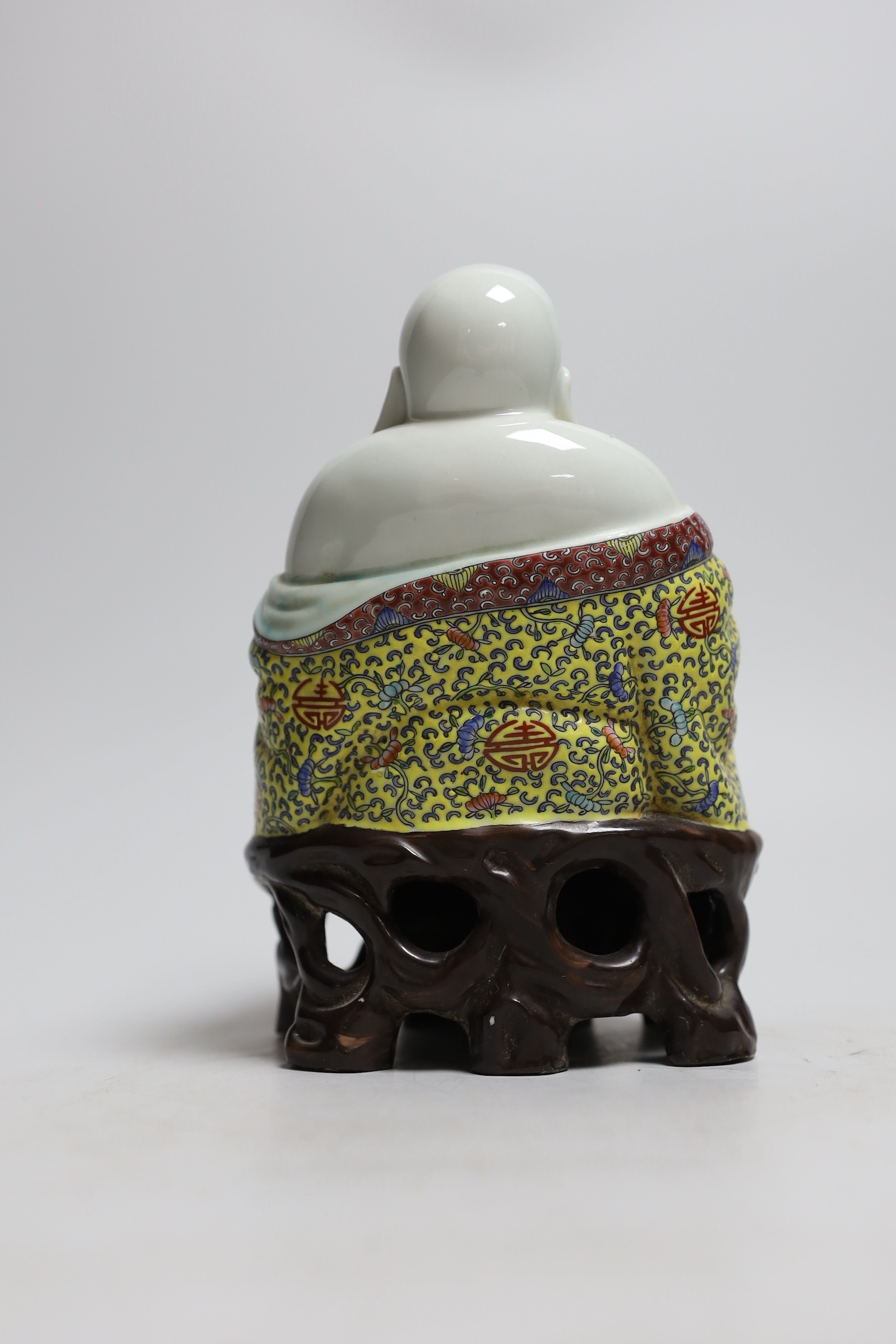 A Chinese enamelled porcelain figure of Budai, 20cm high